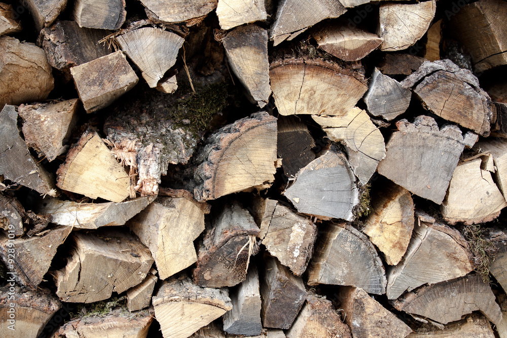Background of dry chopped firewood logs in a pile Background of dry chopped firewood logs in a pile