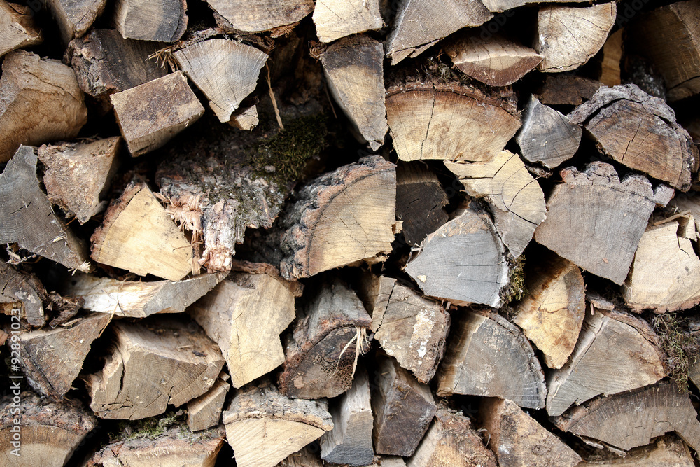 Background of dry chopped firewood logs in a pile Background of dry chopped firewood logs in a pile