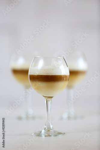 Wine glass with jelly on light background