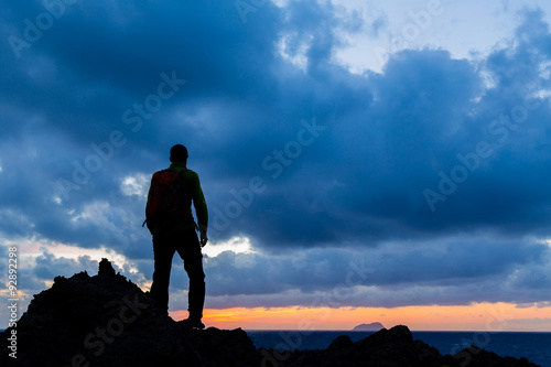 Hiking silhouette backpacker  inspirational sunset landscape