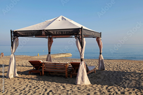 gazebo beds on tropical sand summer beach, Greece photo
