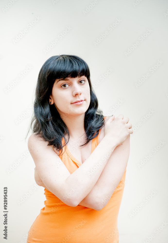 Young woman with orange t-shirt portrait