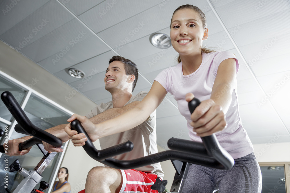 Fototapeta premium smiling woman in cycling class