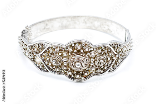 Dutch ornamented (zeeuwse knoop) silver slave bangle bracelet against a white background