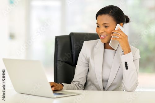 african american businesswoman talking on cell phone