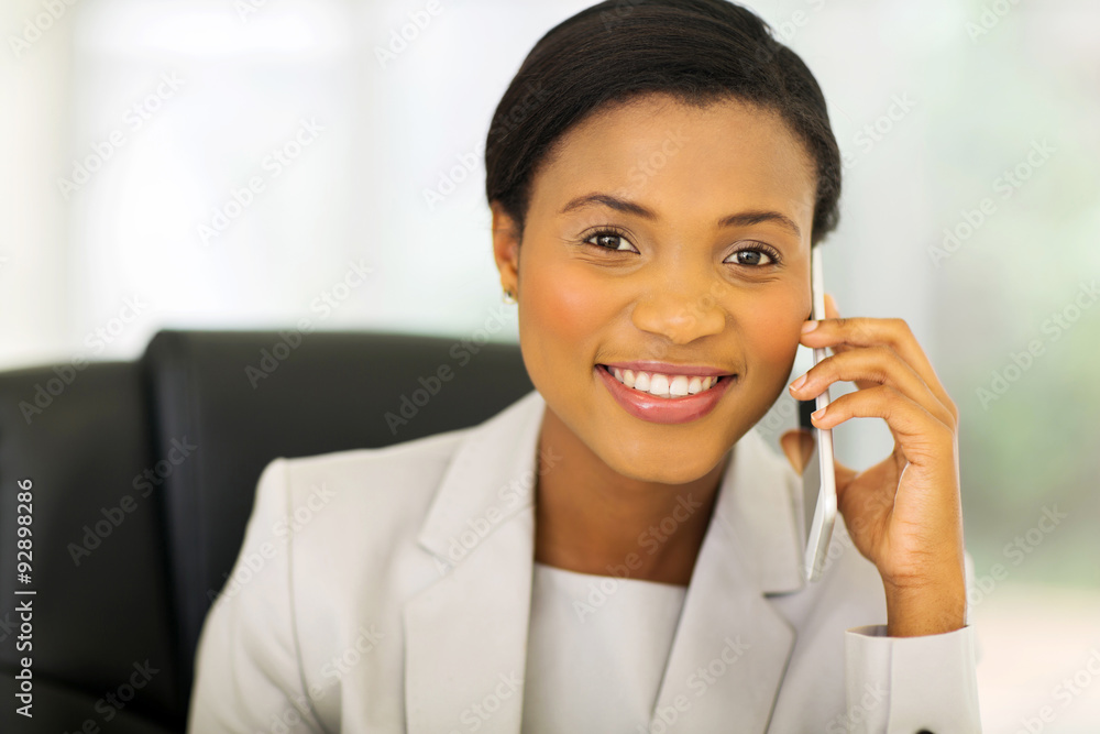 african businesswoman talking on mobile phone african businesswoman talking on mobile phone
