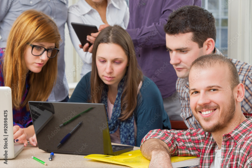 Young group of people discussing business plans. Young group of people discussing business plans.