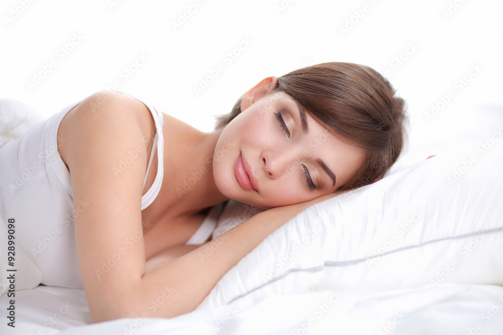Beautiful girl sleeps in the bedroom, lying on bed Beautiful girl sleeps in the bedroom, lying on bed