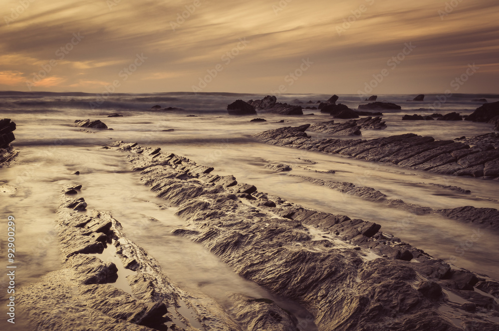 Barrika beach at sunset. Long exposure in the rocky shore