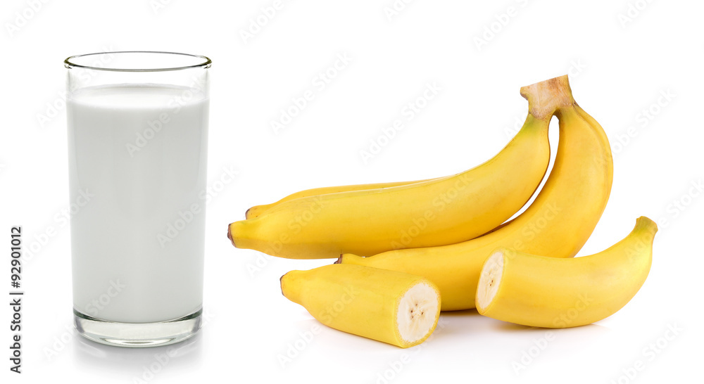 fresh milk in the glass and banana on white background