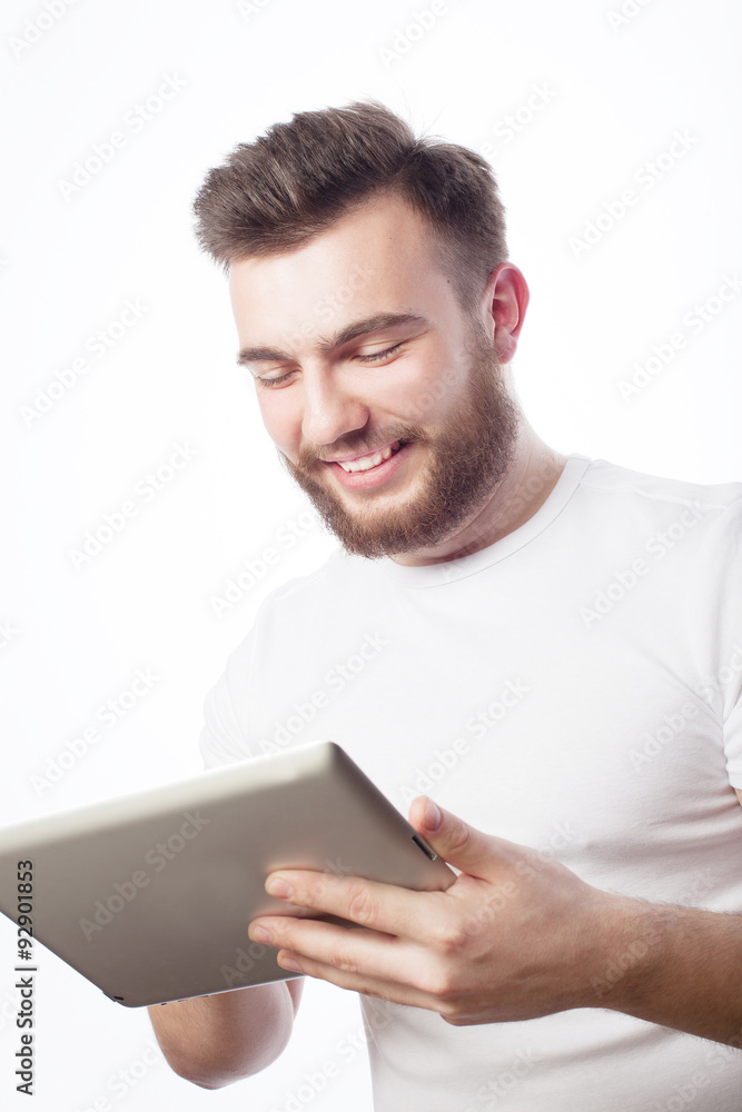 young man using a tablet computer young man using a tablet computer