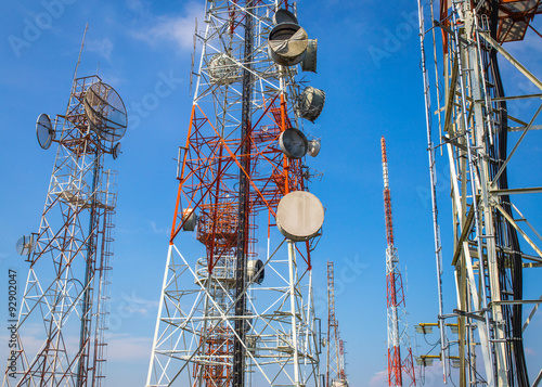 cellular communication towers on blue sky