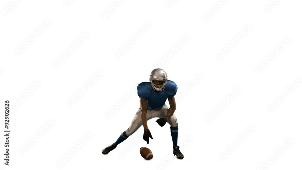 American football player in attack stance American football player in attack stance