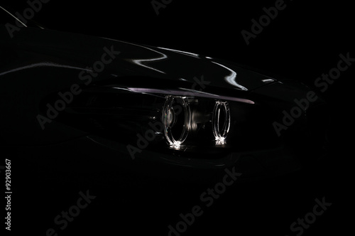 Car headlight with backlight. Exterior detail.