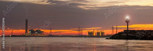 panorama on power plant and natural petroleum gas refinery plant area at twilight