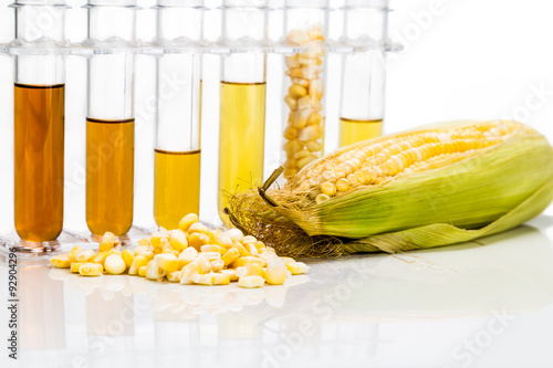 Corn generated ethanol biofuel with test tubes on white background