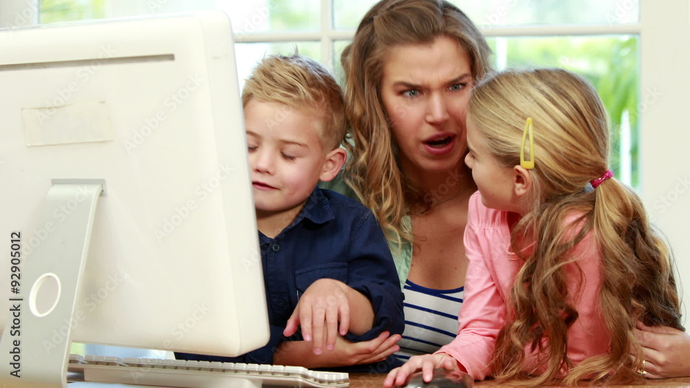 Happy family using the computer Happy family using the computer