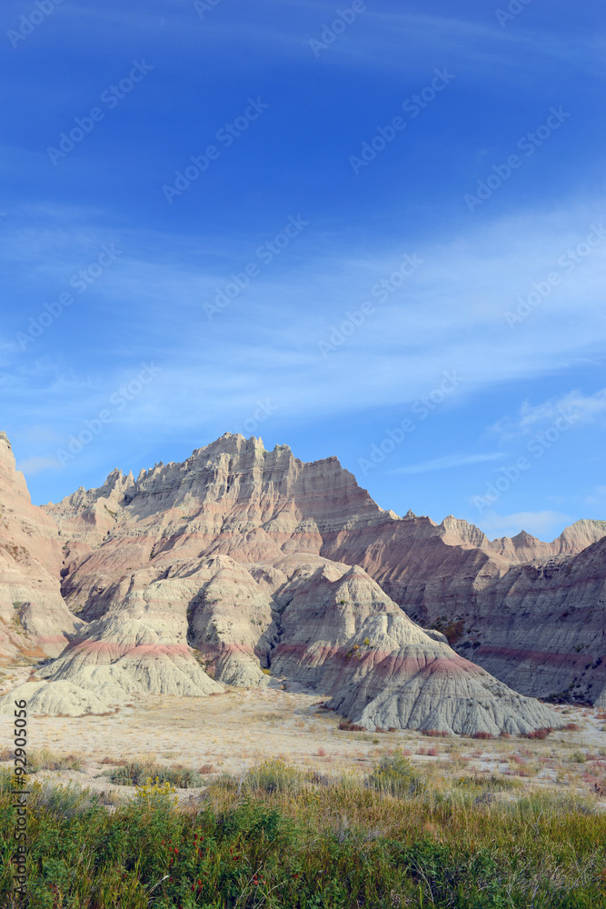 Badlands landscape, formed by deposition and erosion by wind and water, contains some of the richest fossil beds in the world, Badlands National Park, South Dakota, USA Badlands landscape, formed by deposition and erosion by wind and water, contains some of the richest fossil beds in the world, Badlands National Park, South Dakota, USA