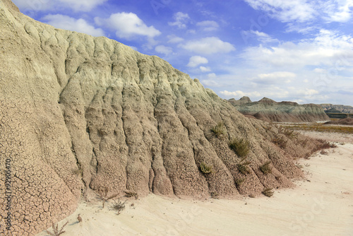 Fotografija Badlands landscape, formed by deposition and erosion by wind and water, contains
