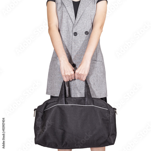 women hand hold the travel bag, black color on white background,