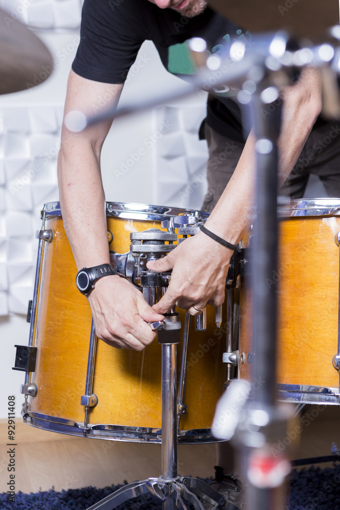 Obraz premium sound technician adjusting the drum.