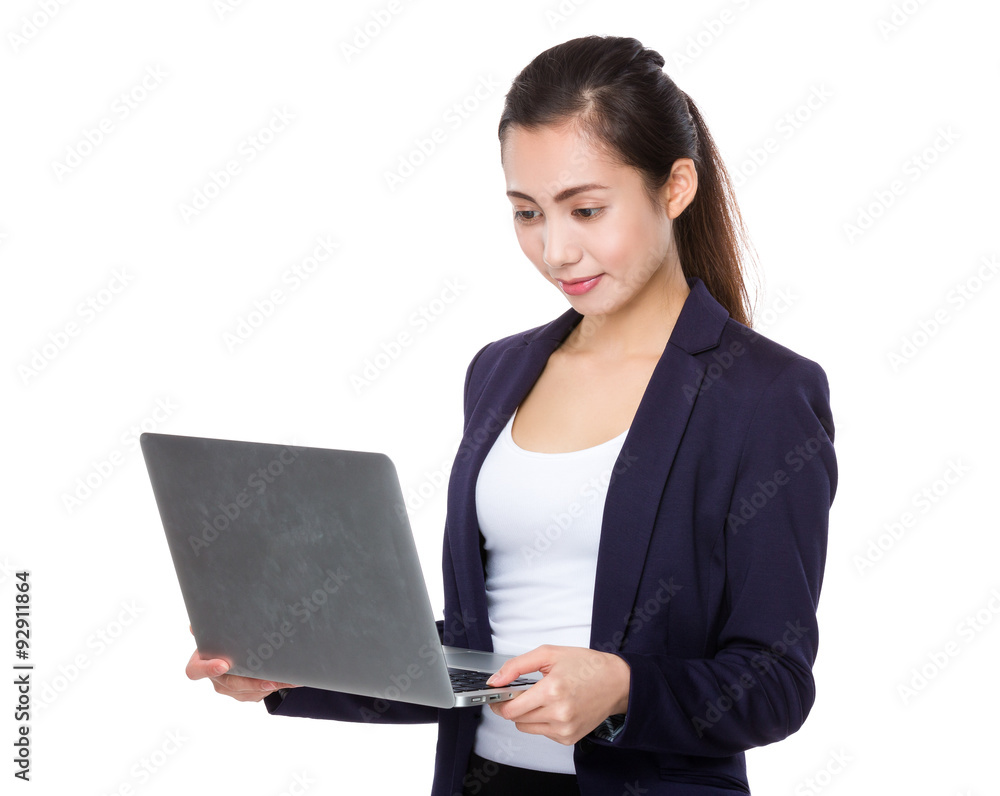 Asian businesswoman use of the laptop computer Asian businesswoman use of the laptop computer