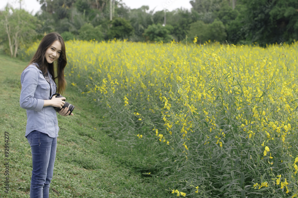 Traveler take a photo in Crotalaria Fields, Songkhla, Thailand Traveler take a photo in Crotalaria Fields, Songkhla, Thailand