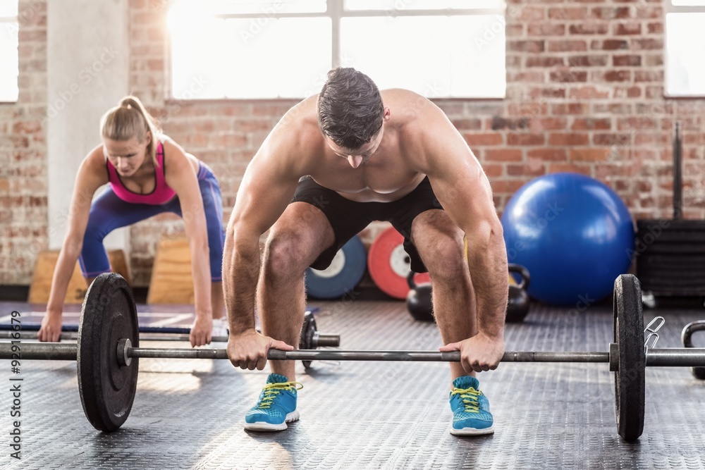 Obraz premium Two fit people working out 