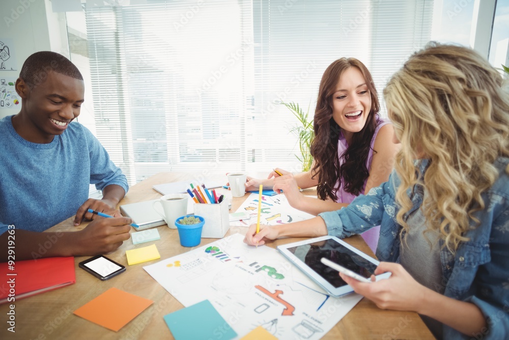 Smiling business people working at desk Smiling business people working at desk