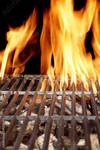 Hot Barbecue Grill With Vibrant Flame On The Black Background