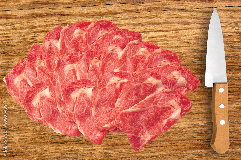 raw meat and knife on cutting wooden board raw meat and knife on cutting wooden board