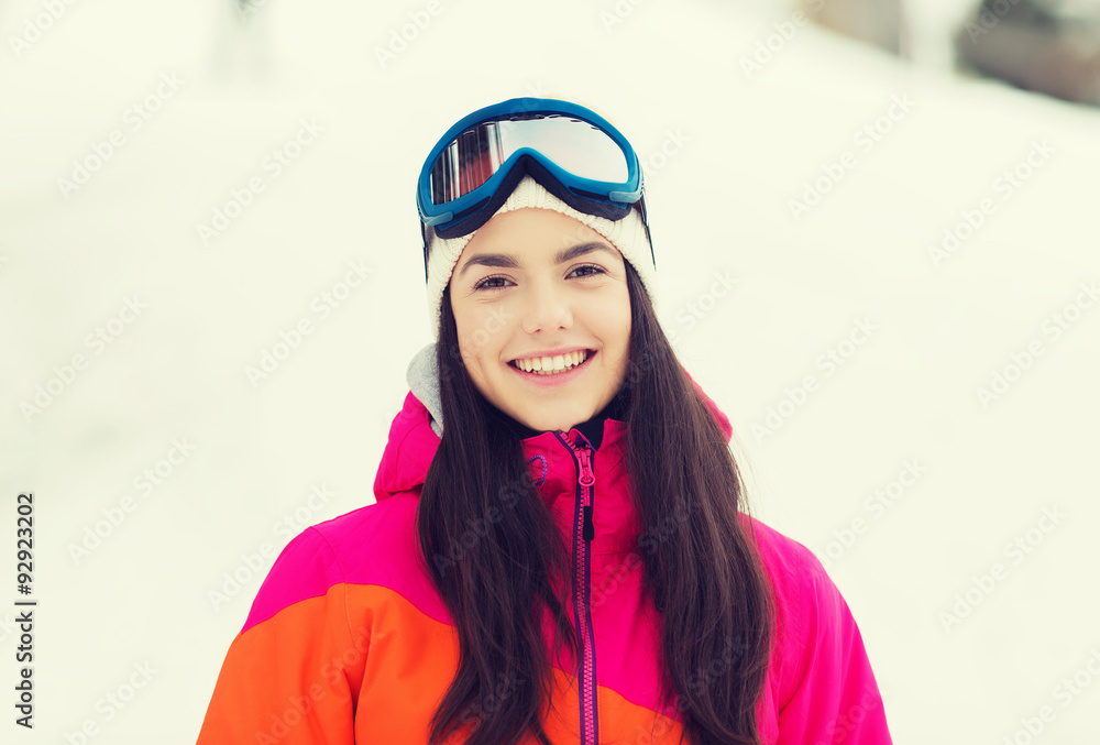 happy young woman in ski goggles outdoors happy young woman in ski goggles outdoors