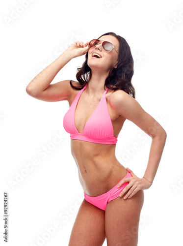 happy woman in sunglasses and bikini swimsuit © Syda Productions