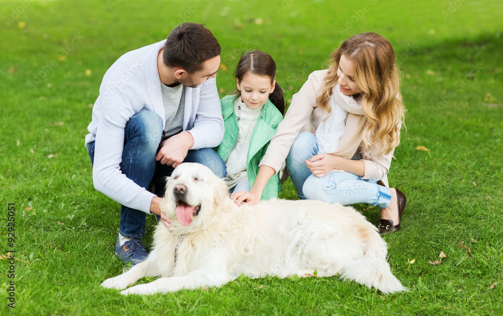 happy family with labrador retriever dog in park happy family with labrador retriever dog in park