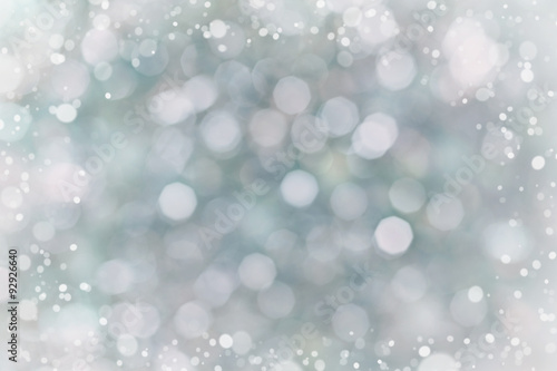Abstract bokeh background for your design, blurred lights with snow effect, blue color, vintage toned