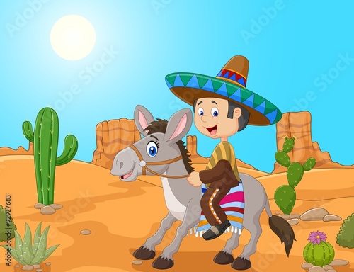 Mexican men driving a donkey in the desert background 