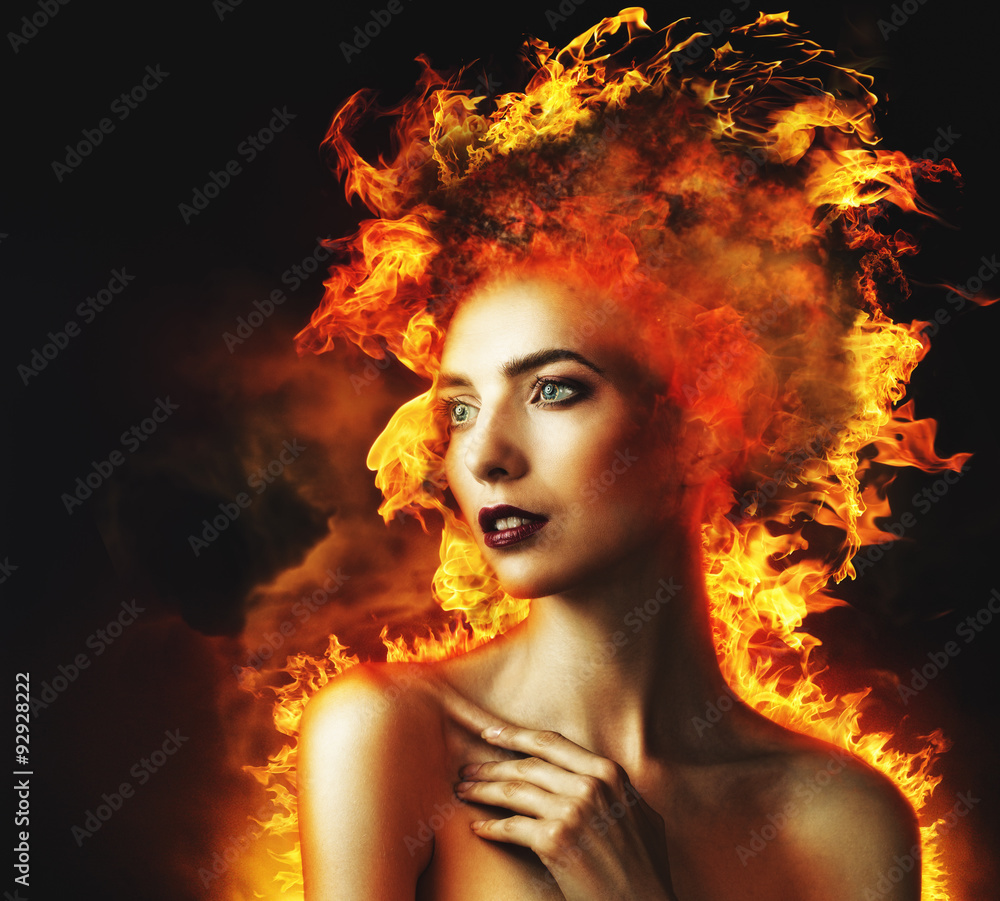 Firestarter. Abstract beauty portrait with burning flame as part