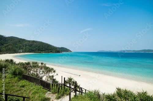 Tropical paradise island beach lagoon and white sand beach full of beautiful clear blue turquoise water in Amami Oshima  Kagoshima  Okinawa  Tropical Japan during Summer vacation