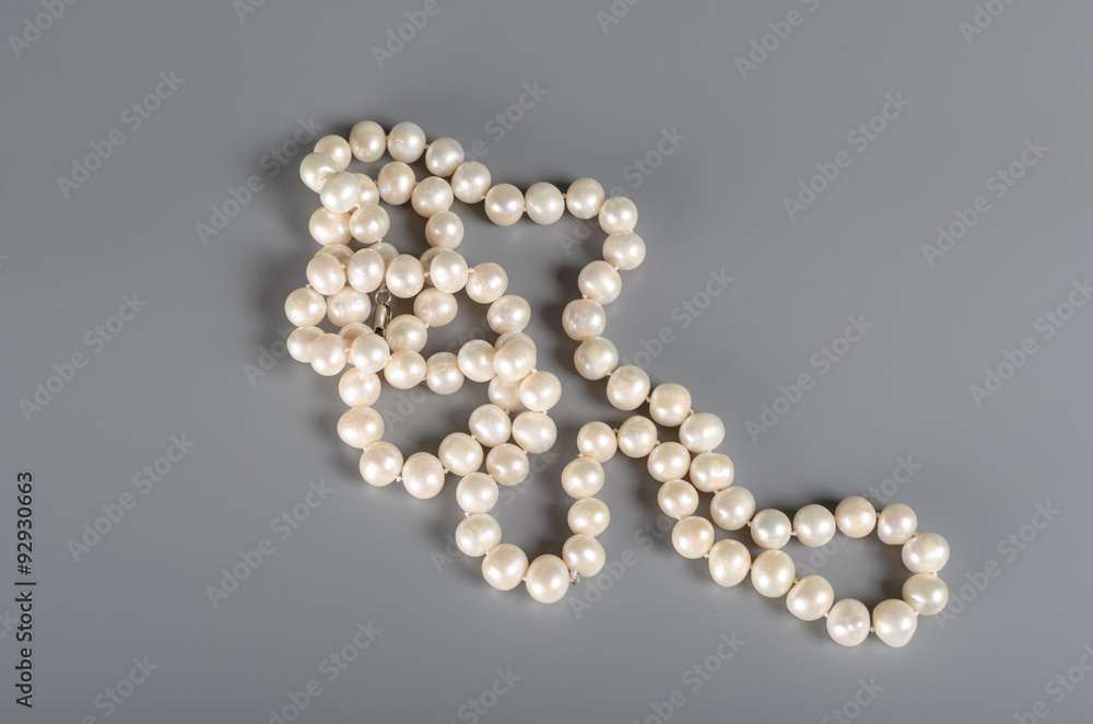 pearl necklace on gray background pearl necklace on gray background