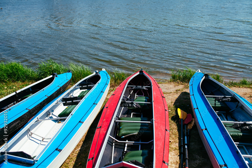 Empty kayaks on the shore of the river. Empty kayaks on the shore of the river.