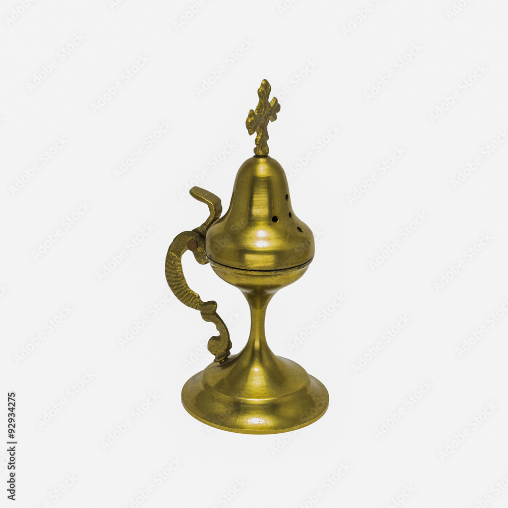 Closed incense burner with a cross isolated on a white background Closed incense burner with a cross isolated on a white background