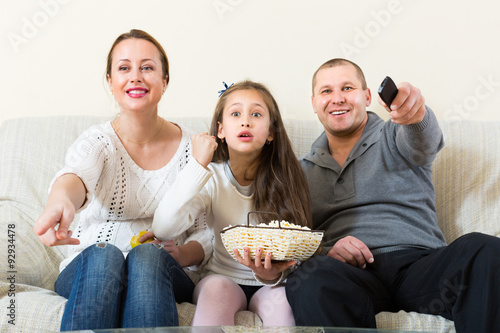 Family watching TV show