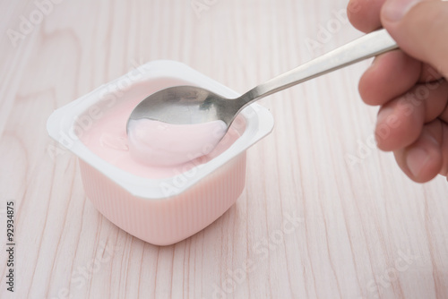 eating strawberry flavor yogurt
