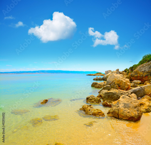yellow rocks and clear water