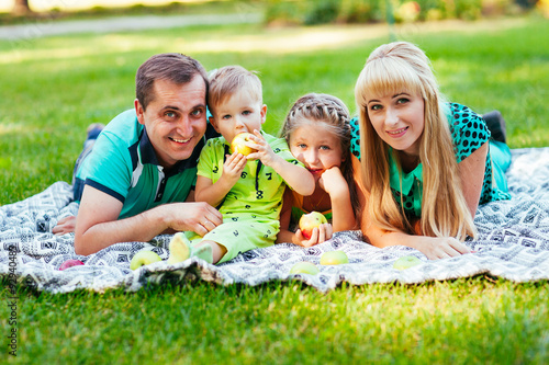 Family lying down in the park