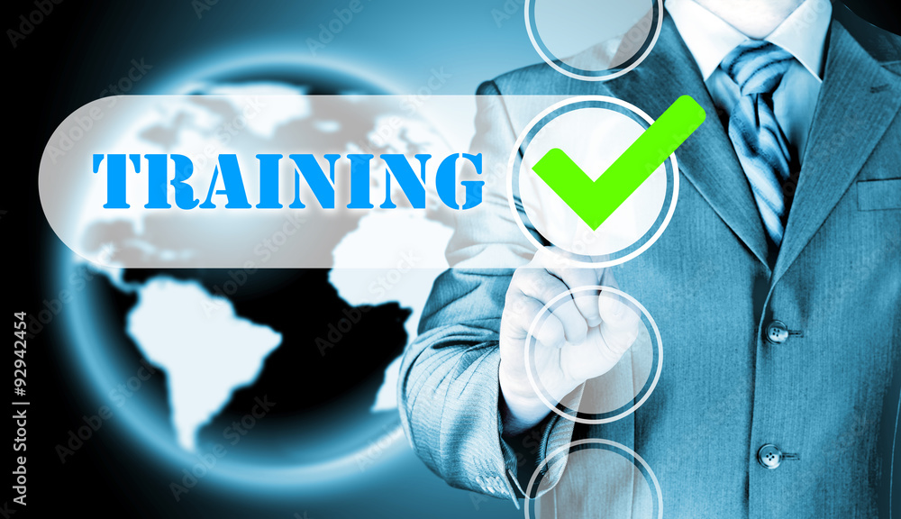 Businessman pressing touch screen interface training checkbox Businessman pressing touch screen interface training checkbox