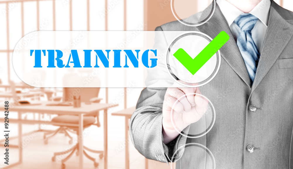 Businessman pressing touch screen interface training checkbox Businessman pressing touch screen interface training checkbox