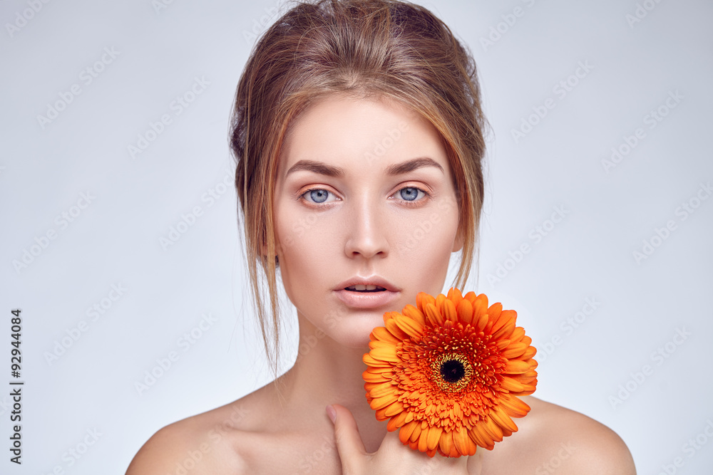 Close-up face of girl with flower in her hand Close-up face of girl with flower in her hand