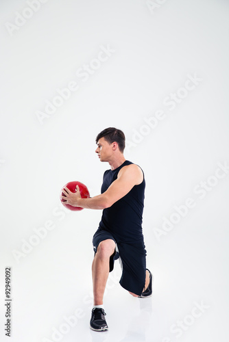 Athletic man workout with fitness ball