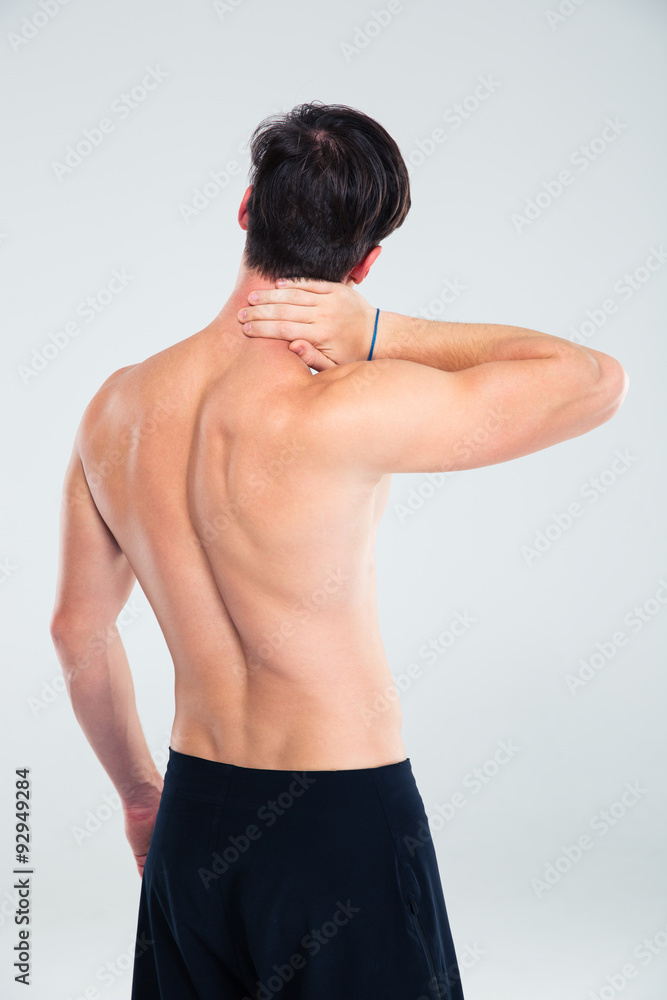 Obraz premium Back view portrait of a man having neck pain